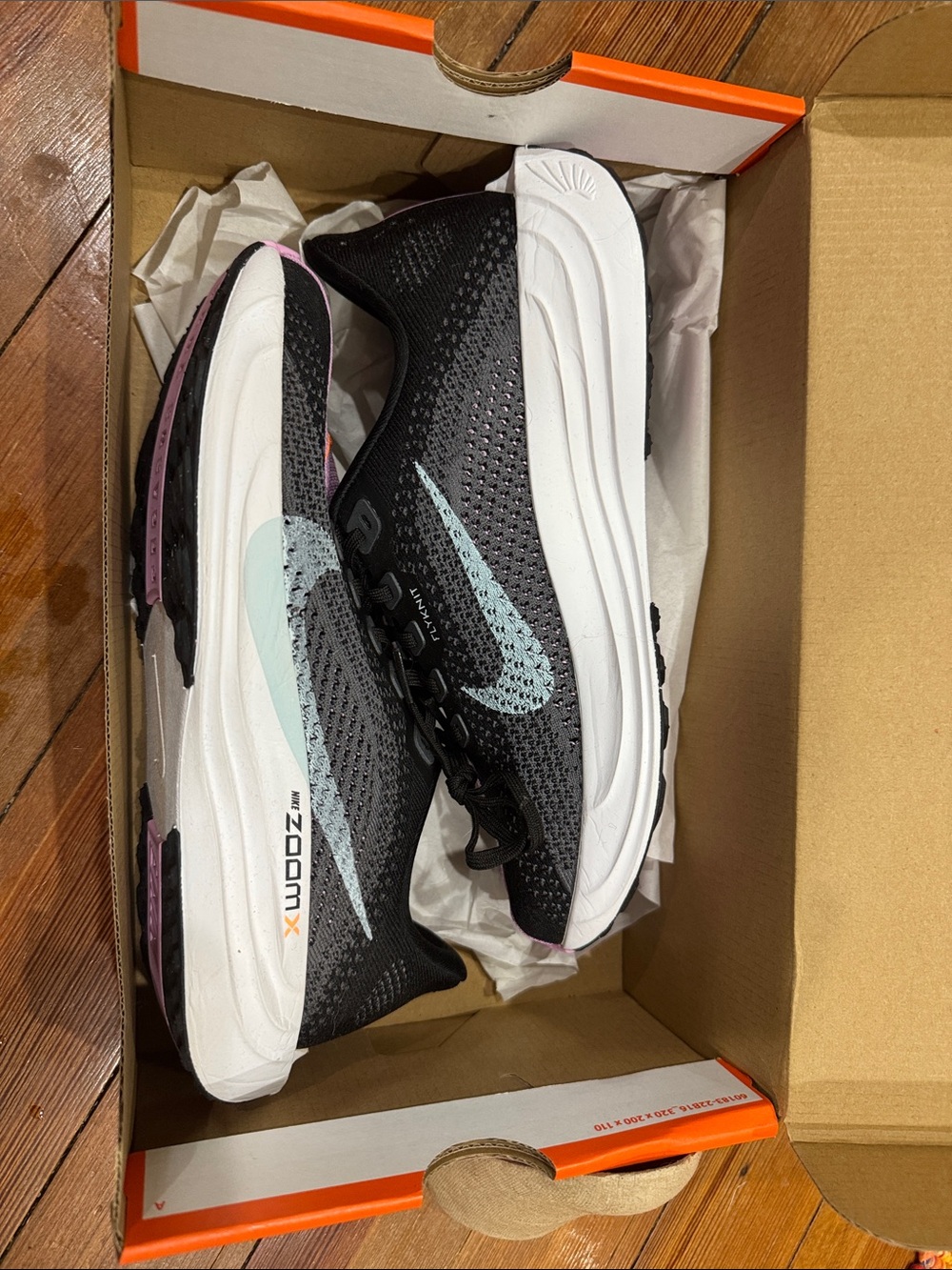Nike Women’s Black Running Shoes with Light Blue Swoosh and Pink Accents
